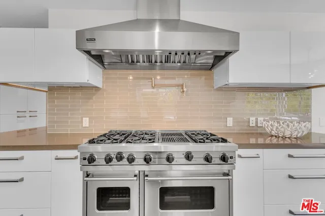 a bathroom with a shower and a sink