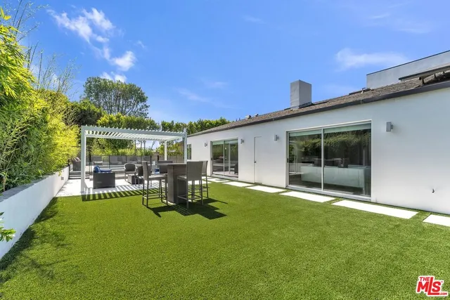 a spacious bedroom with a bed and a window