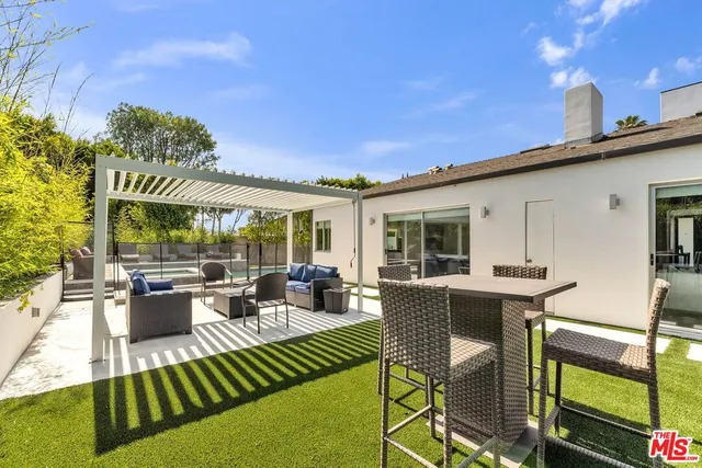 a spacious bedroom with a bed and a couch