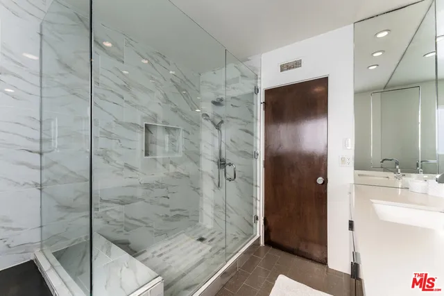 a large white bed in a white room