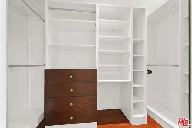 a bathroom with a sink vanity mirror and toilet