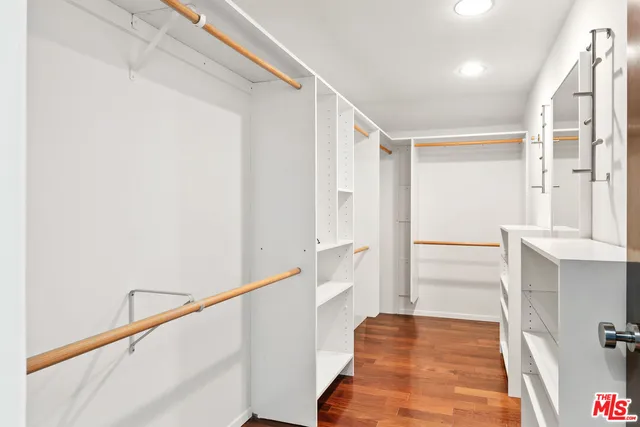 a view of a hallway view with wooden floor and staircase