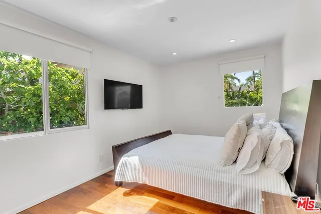 an aerial view of a house with a garden and plants