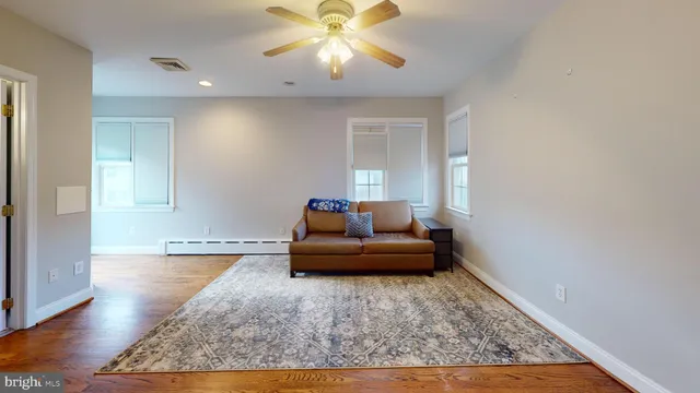 a living room with furniture and a rug