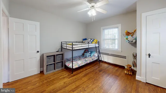 a bedroom with furniture and a window