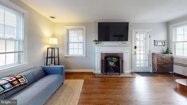 a living room with furniture fireplace and flat screen tv