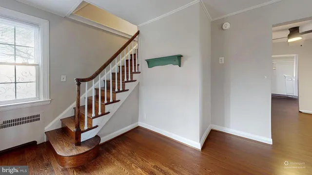 a view of an entryway with wooden floor