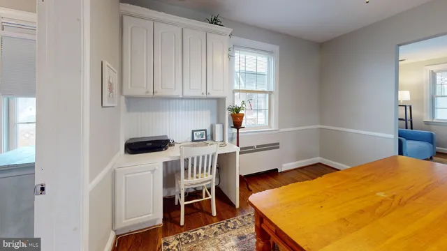 a bedroom with a bed and a table in it