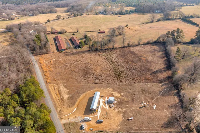 a view of outdoor space with trees all around