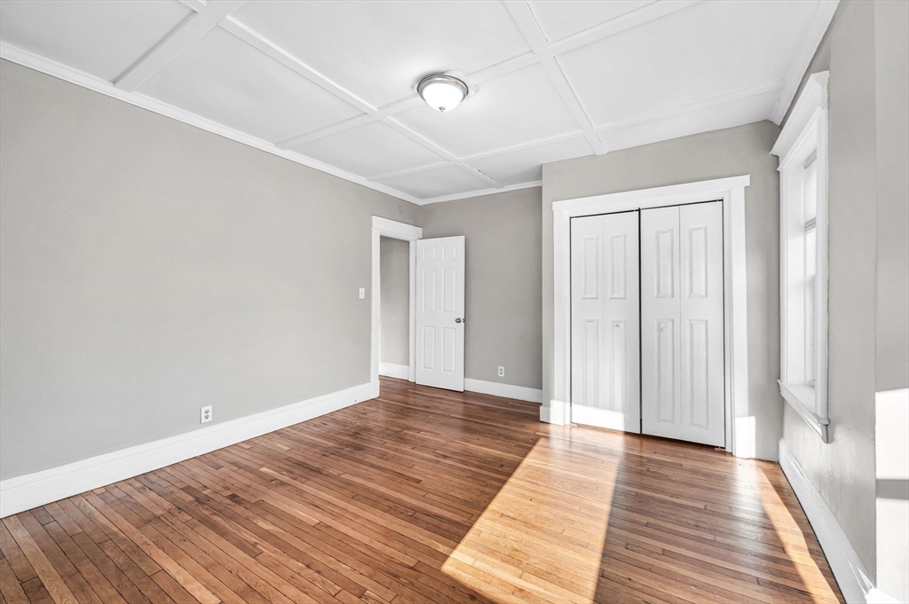 92 Woodside Terrace, Unit 2R Springfield, MA 01108 - Photo 22 of 42 a view of an empty room with wooden floor