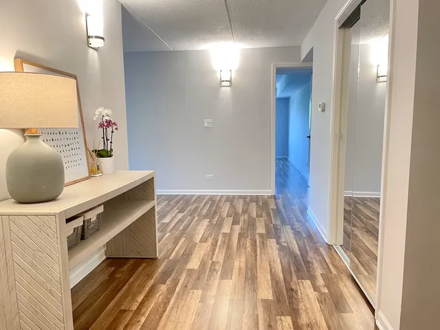 a living room with a bed and a table