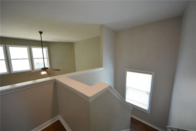 a room with window and ceiling fan