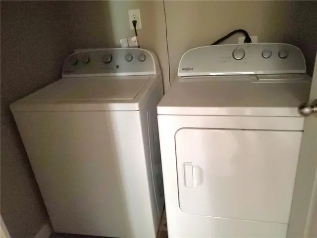 a utility room with dryer and washer