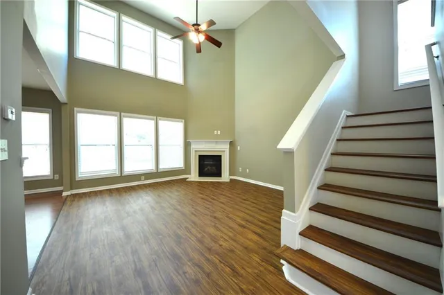 wooden floor in an empty room with a window and wooden floor