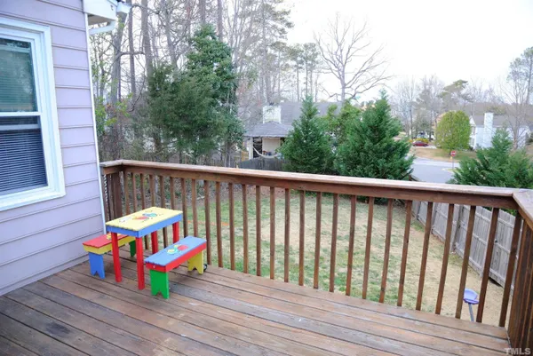 a wooden bench sitting in front of a building