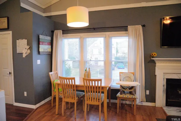 a view of a livingroom with furniture window and wooden floor
