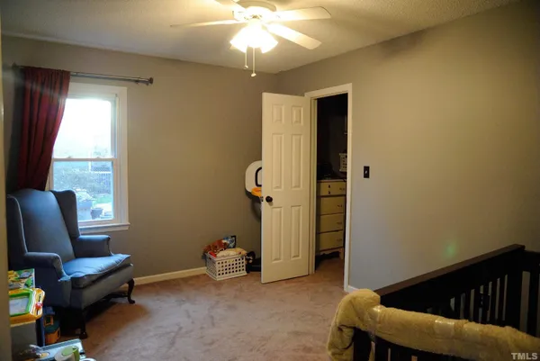 a view of a livingroom with furniture and windows