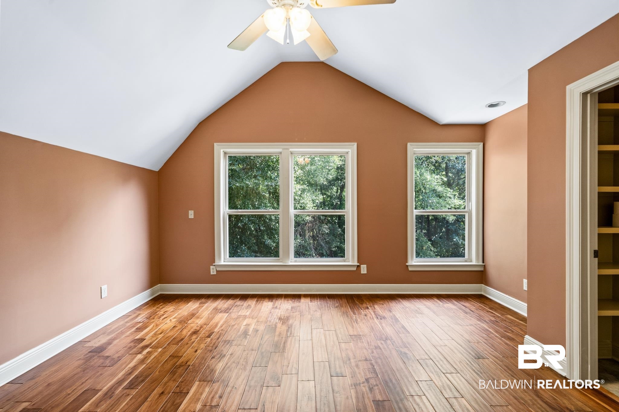 8321 Dixon Road Bay Minette, AL 36507 - Photo 44 of 79 Additional living space featuring ceiling fan, lofted ceiling, plenty of natural light, and hardwood / wood-style floors