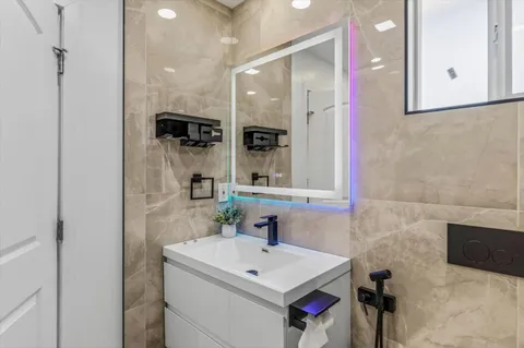 a bathroom with a sink and a mirror