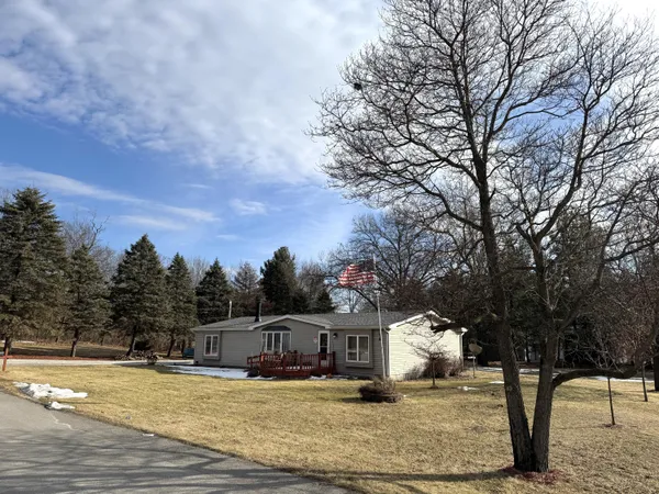 a view of a house with snow on the background