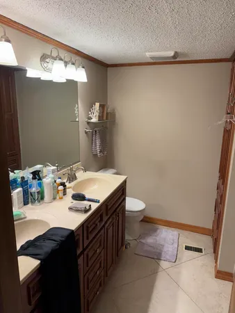 a bathroom with a sink and mirror