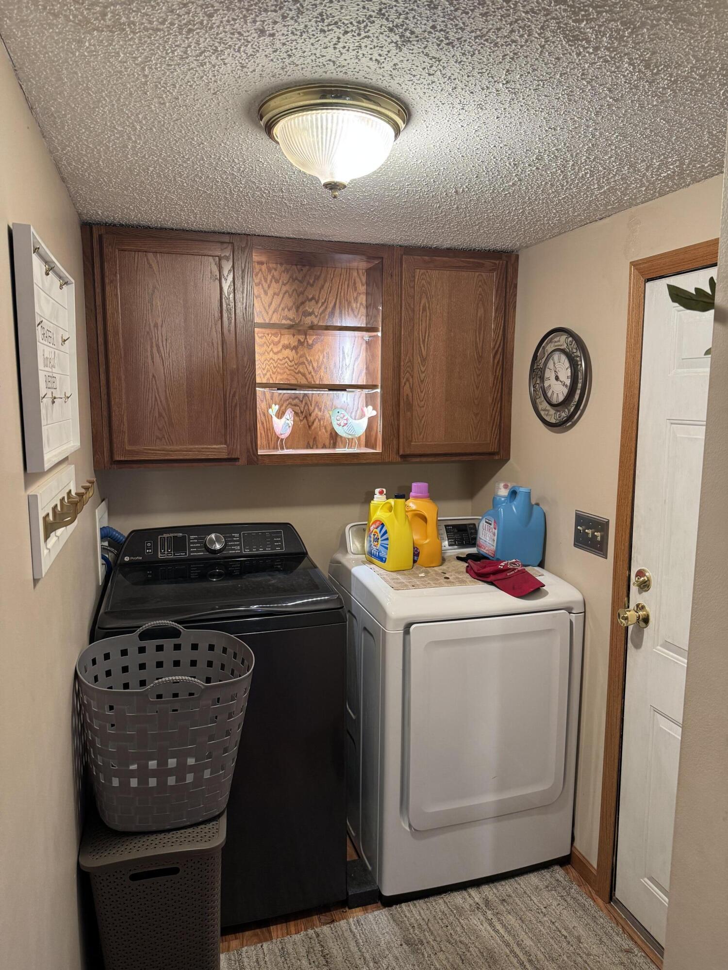 25 East Carter Street Wheatfield, IN 46392 - Photo 17 of 22 a view of a storage and utility room with washer and dryer