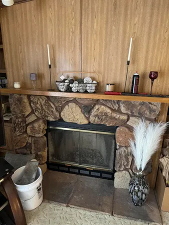 a bathroom with a granite countertop sink and a toilet