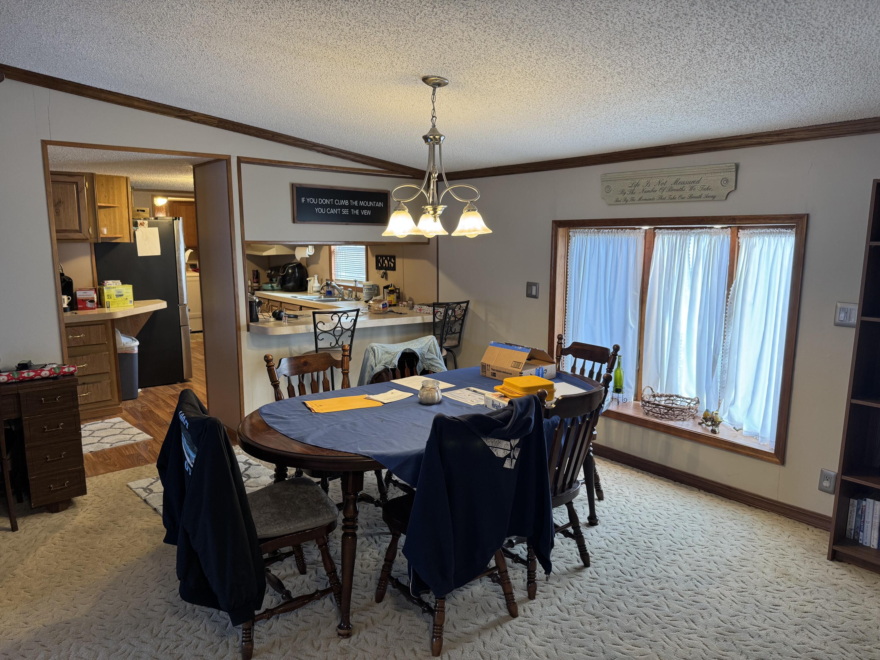 25 East Carter Street Wheatfield, IN 46392 - Photo 8 of 22 a view of a dining room with furniture and window