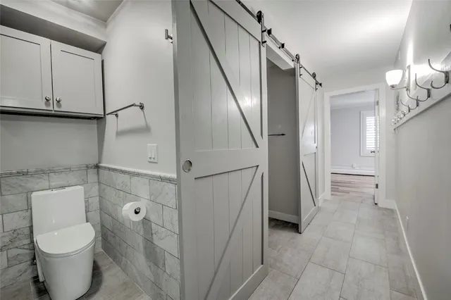 a bathroom with a toilet and a sink