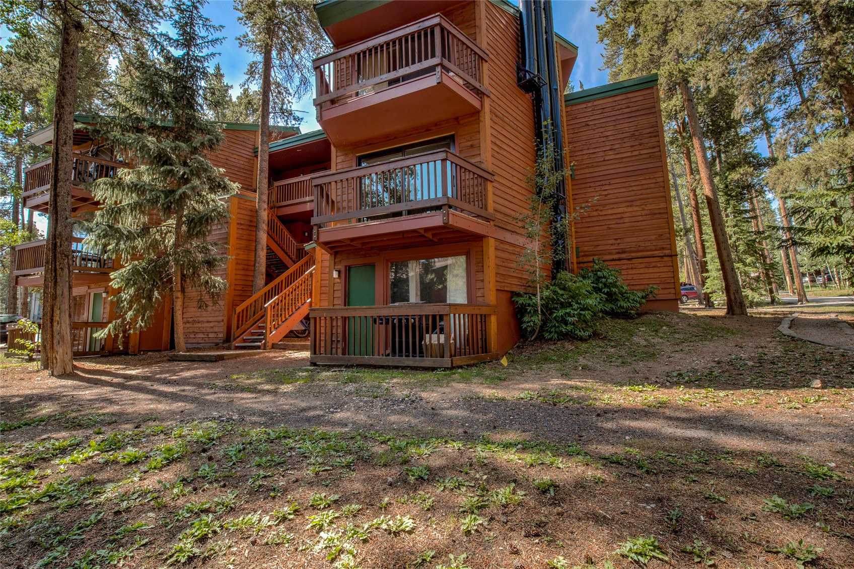 1120 Ski Hill Road, Unit 16 Breckenridge, CO 80424 - Photo 22 of 23 a view of a house with a yard
