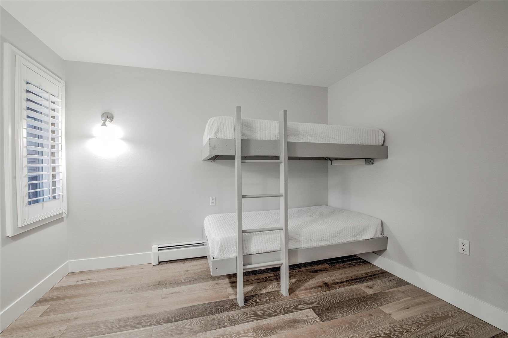 1120 Ski Hill Road, Unit 16 Breckenridge, CO 80424 - Photo 8 of 23 a bedroom with a bunk bed and a window