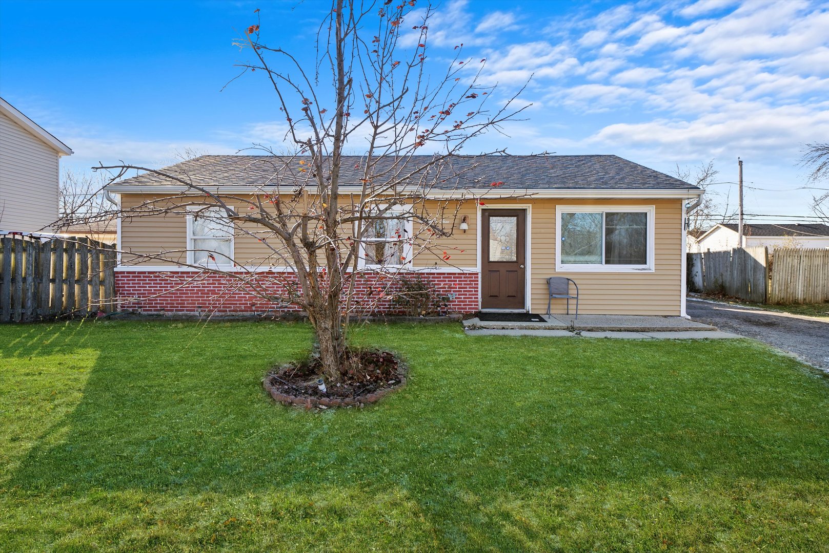 233 Rockhurst Road Bolingbrook, IL 60440 - Photo 1 of 29 a front view of a house with a garden