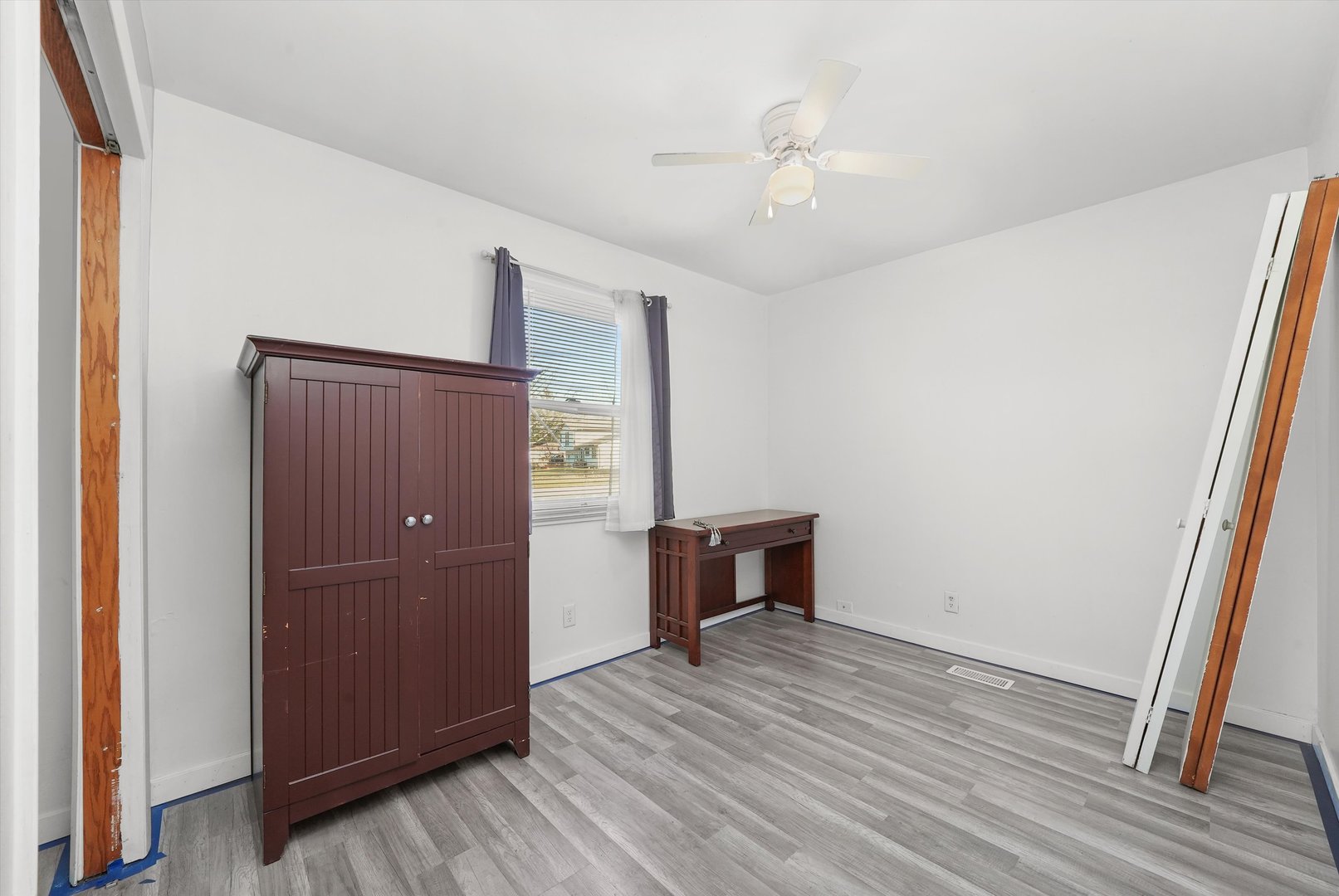 233 Rockhurst Road Bolingbrook, IL 60440 - Photo 15 of 29 an empty room with wooden floor and entrance