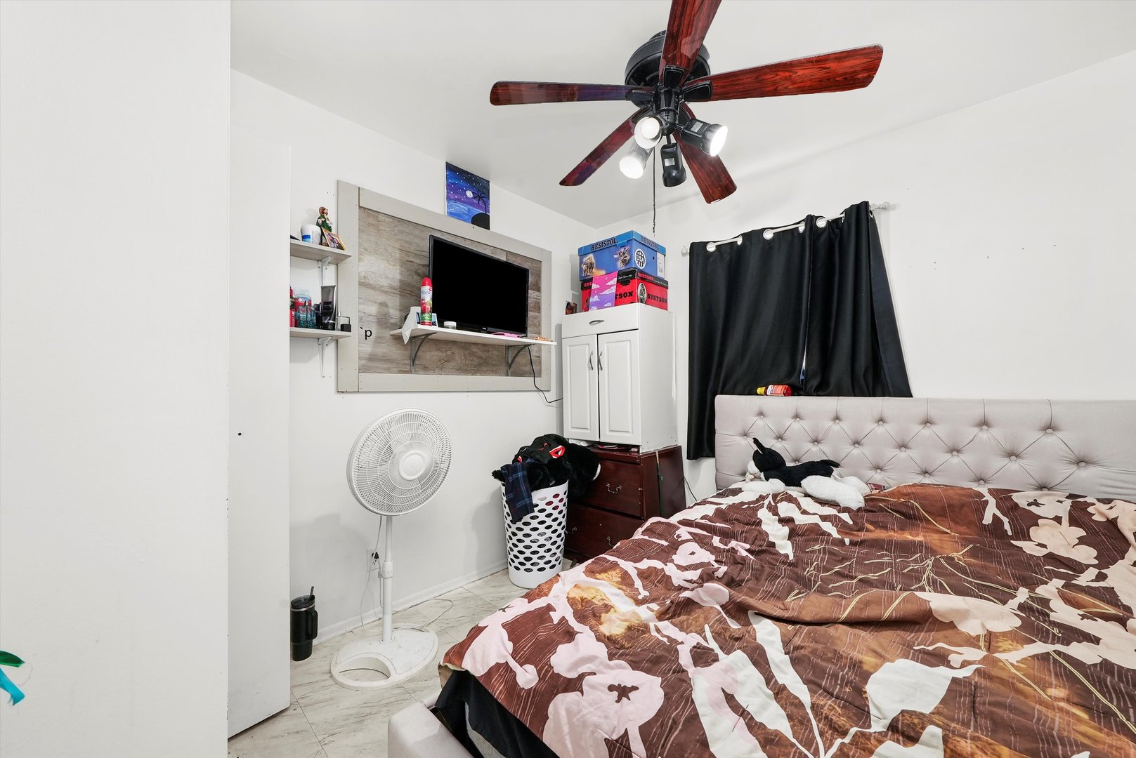 233 Rockhurst Road Bolingbrook, IL 60440 - Photo 17 of 29 a bedroom with a bed and a flat screen tv