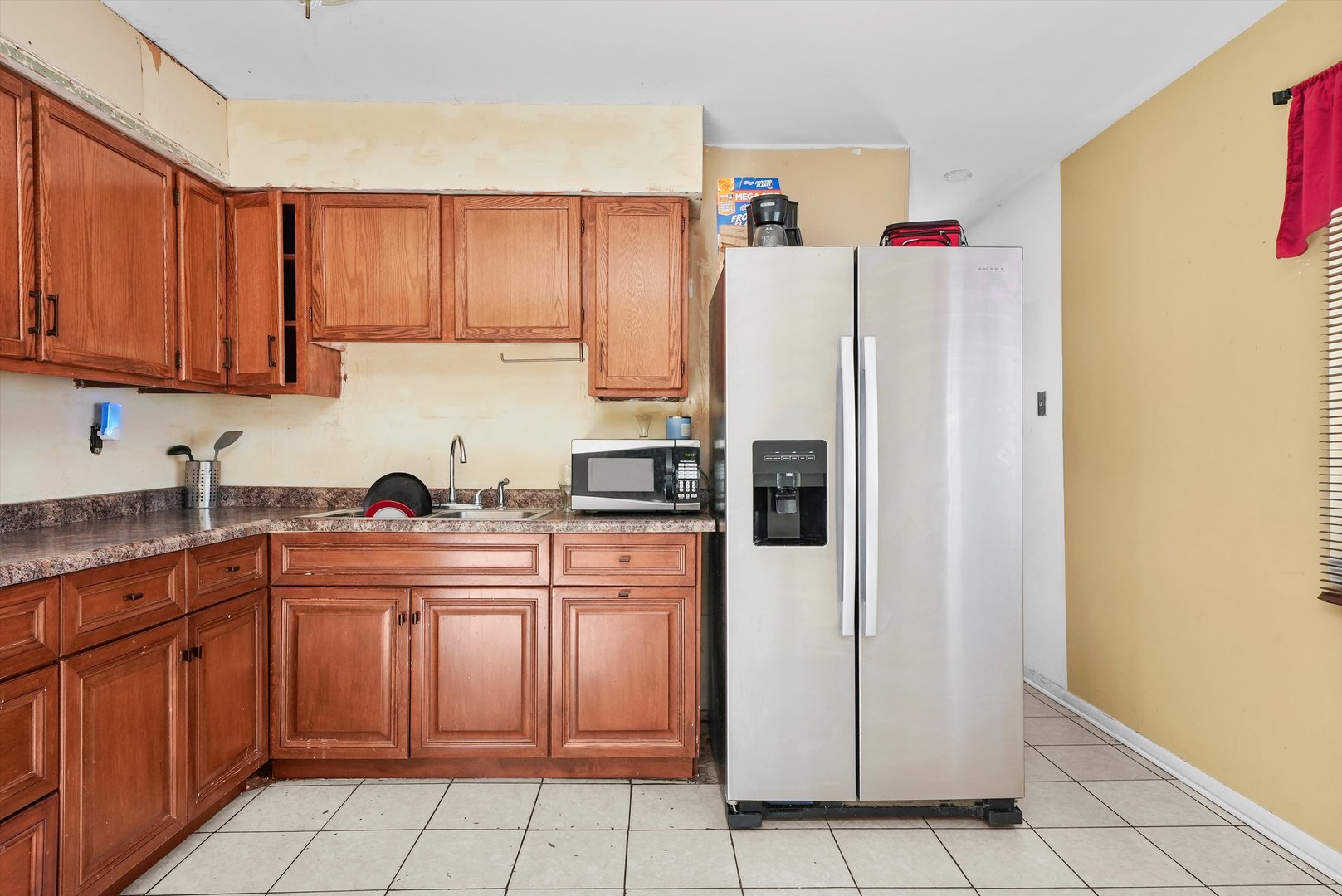 233 Rockhurst Road Bolingbrook, IL 60440 - Photo 19 of 29 a kitchen with stainless steel appliances a refrigerator sink and cabinets