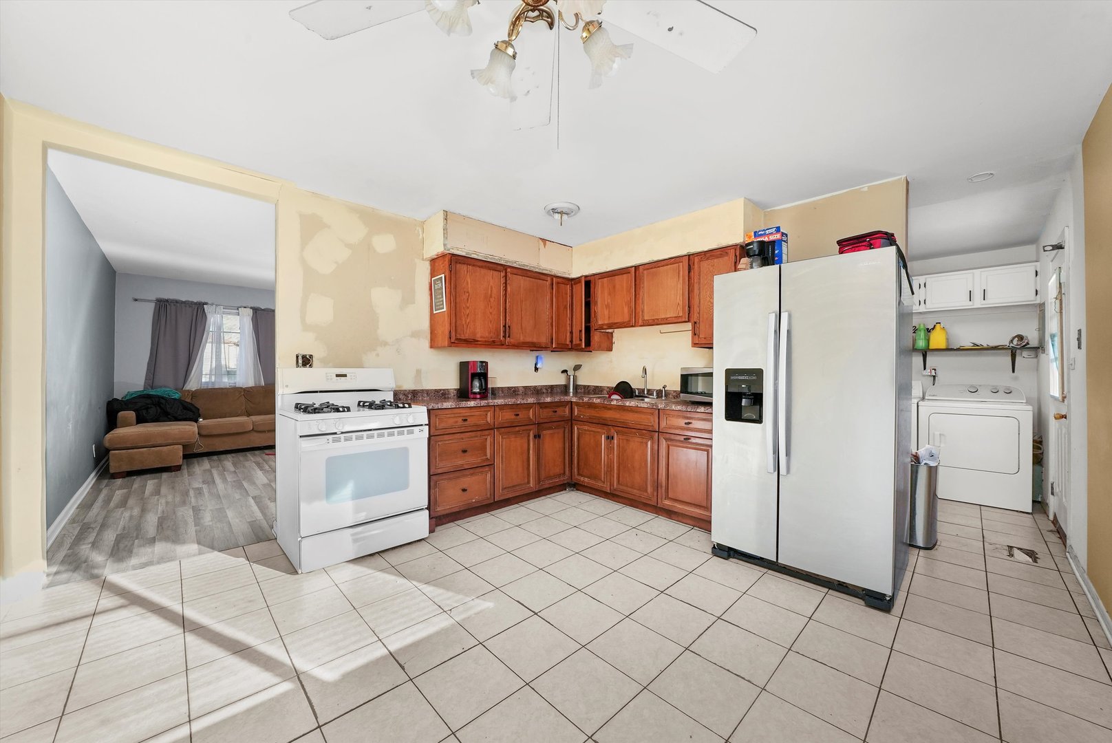 233 Rockhurst Road Bolingbrook, IL 60440 - Photo 20 of 29 a kitchen with a refrigerator a stove top oven and a sink