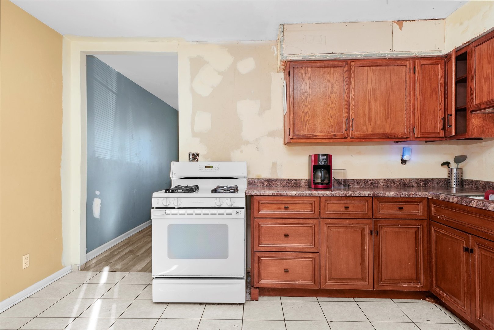233 Rockhurst Road Bolingbrook, IL 60440 - Photo 21 of 29 a kitchen with cabinets appliances and a sink
