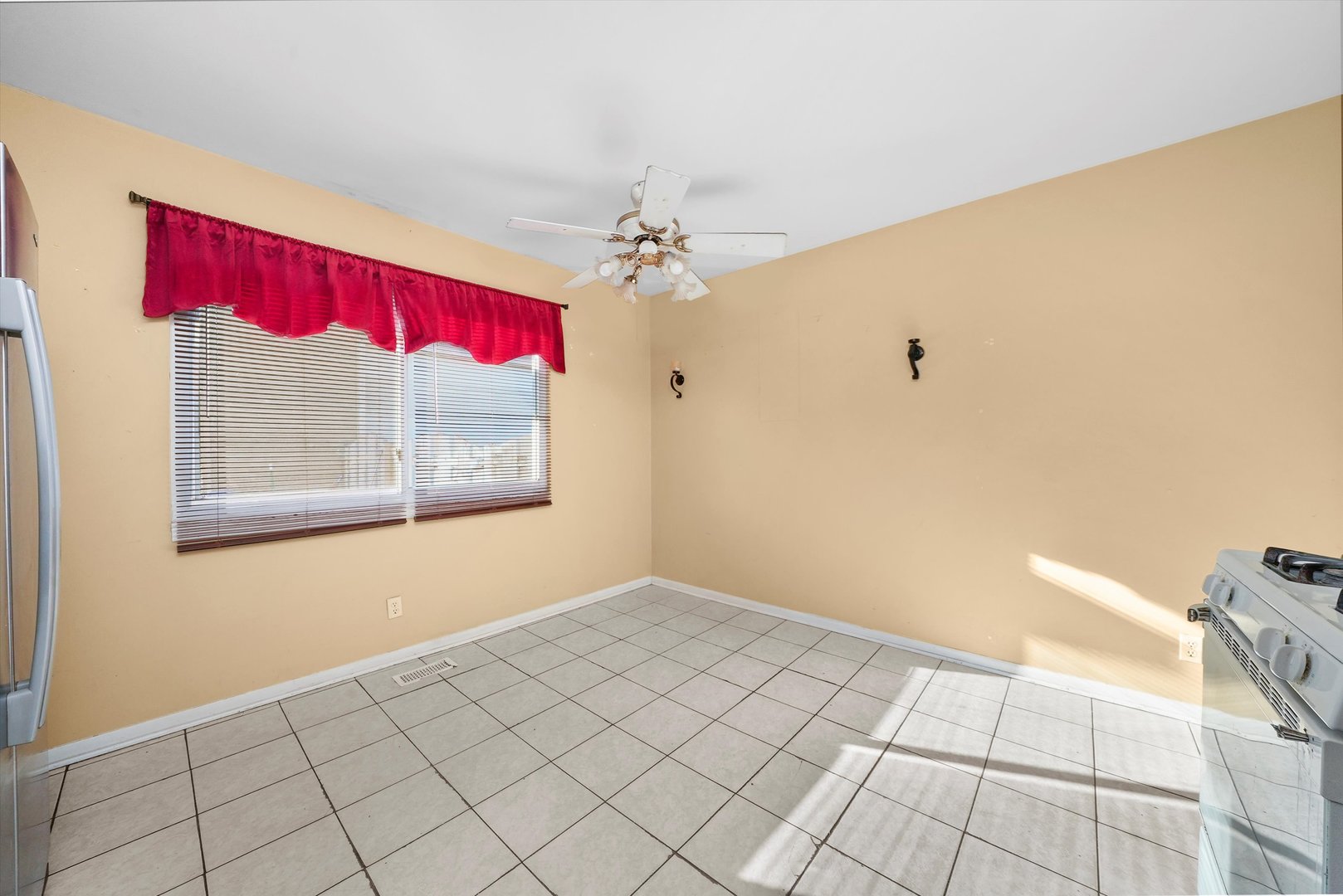 233 Rockhurst Road Bolingbrook, IL 60440 - Photo 23 of 29 a view of a room with window and a ceiling fan