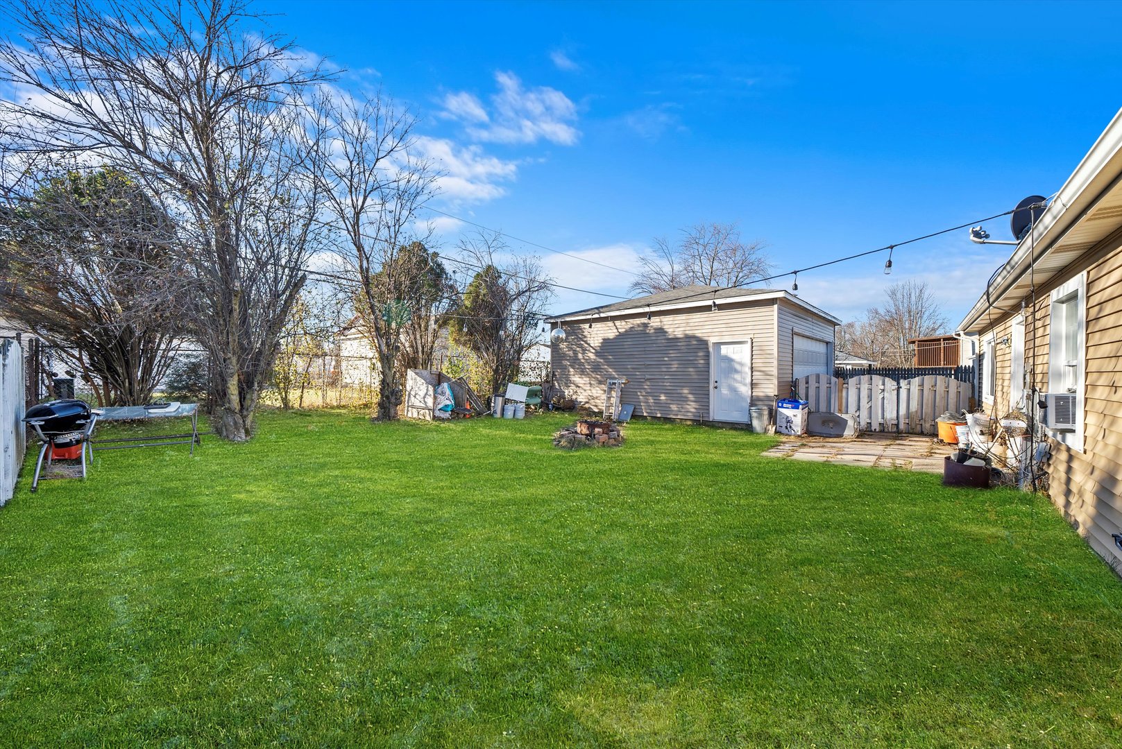 233 Rockhurst Road Bolingbrook, IL 60440 - Photo 26 of 29 a backyard of a house with lots of green space