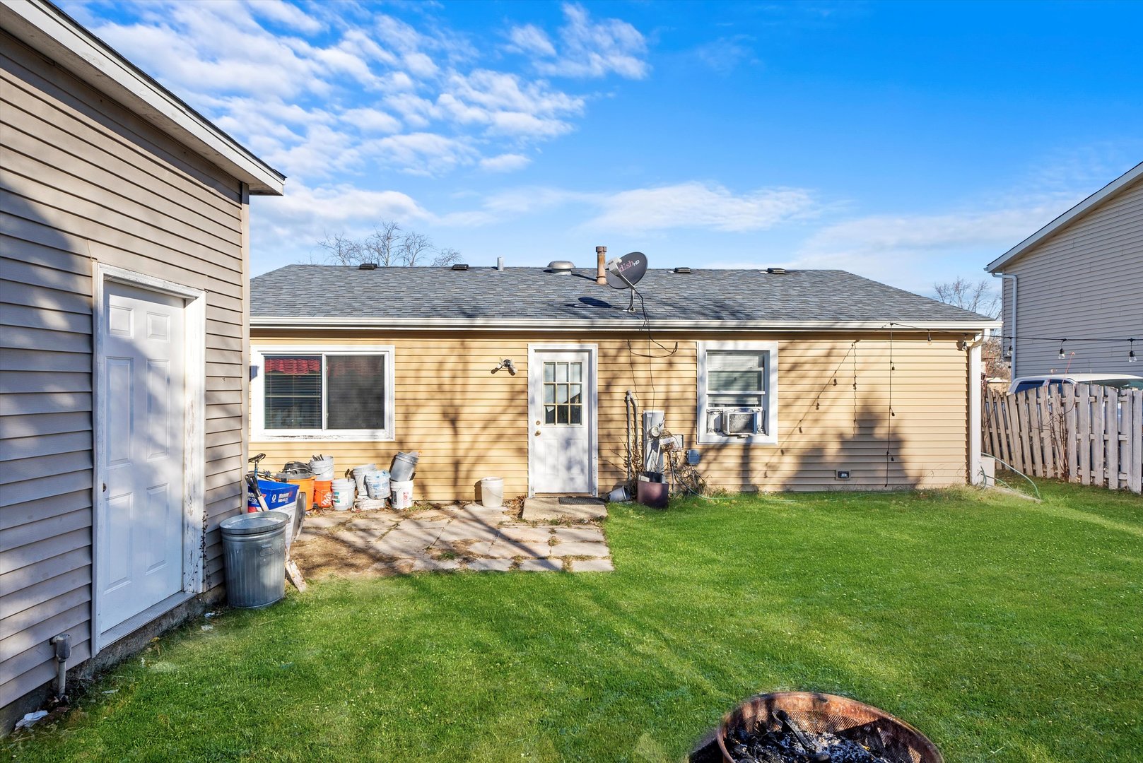 233 Rockhurst Road Bolingbrook, IL 60440 - Photo 27 of 29 a view of a house with a backyard porch and sitting area