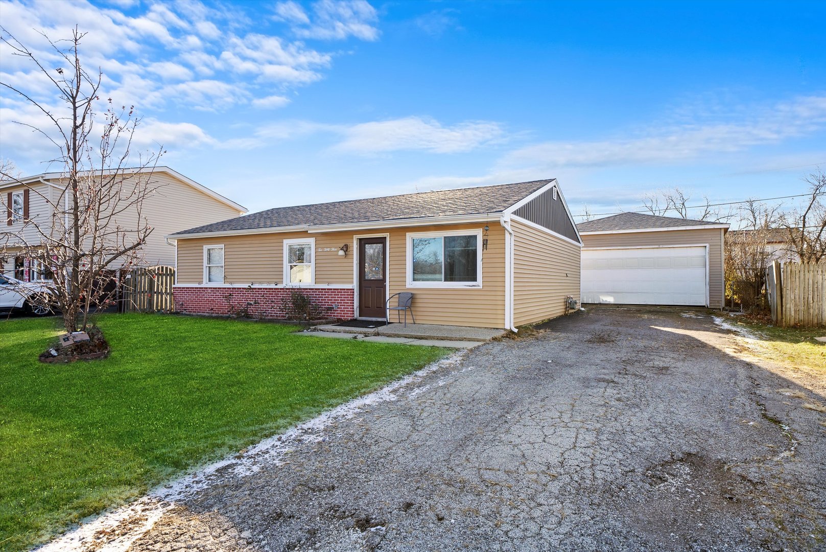 233 Rockhurst Road Bolingbrook, IL 60440 - Photo 4 of 29 a view of a house with a yard and fence