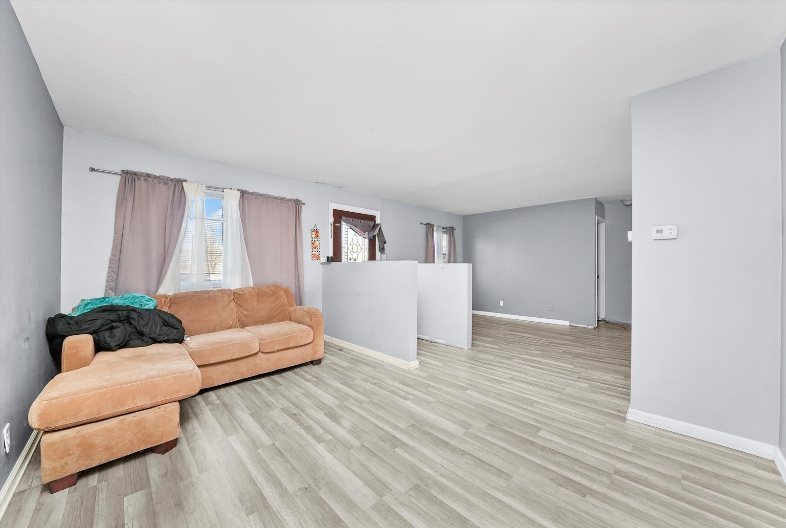 233 Rockhurst Road Bolingbrook, IL 60440 - Photo 7 of 29 a living room with furniture and wooden floor