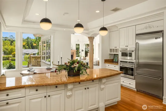 a kitchen with counter top space and stainless steel appliances