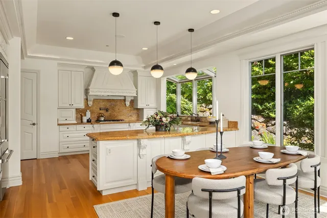 a kitchen with a table and chairs in it