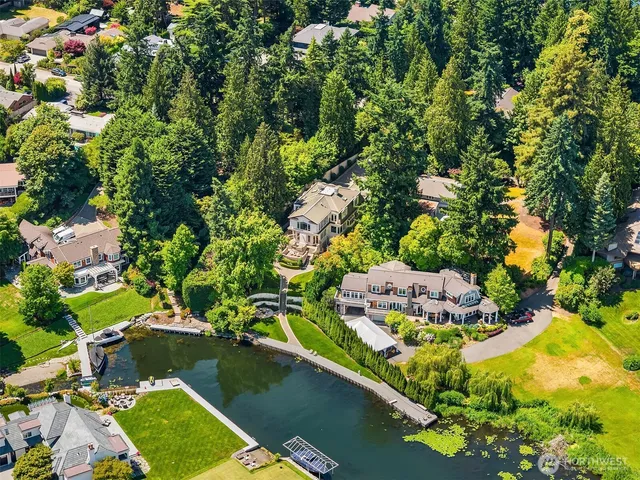 an aerial view of a house with a yard