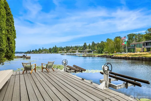 a view of a lake with outdoor seating