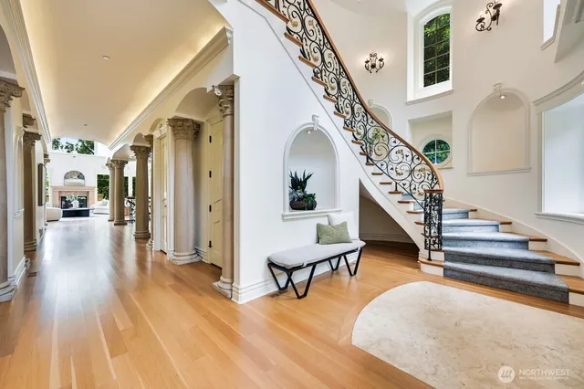 a view of entryway and hall with wooden floor