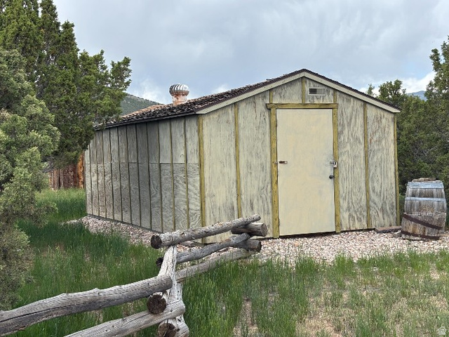14908 North Deep Crk Road Lapoint, UT 84039 - Photo 4 of 9 Wood-sided outbuilding with a single entry door and a shingled roof