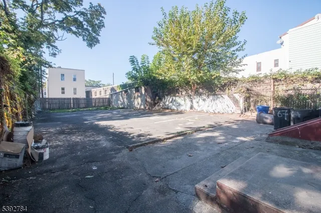 a view of road with large trees