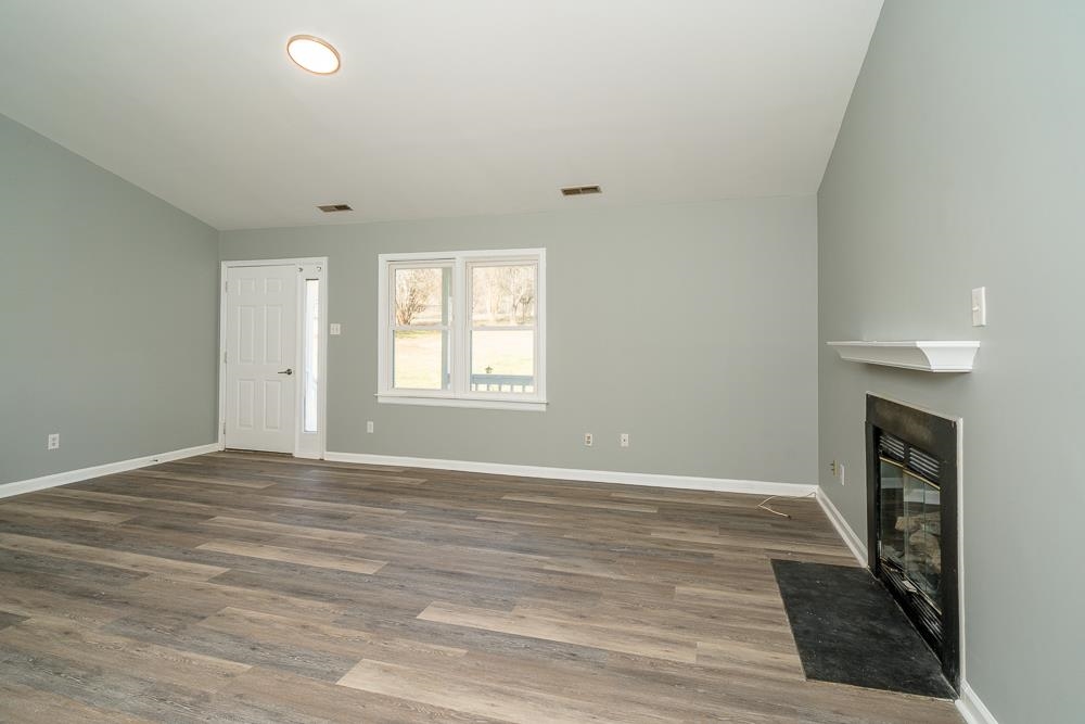 80 Phlox Road Ruckersville, VA 22968 - Photo 2 of 30 wooden floor in an empty room with a window